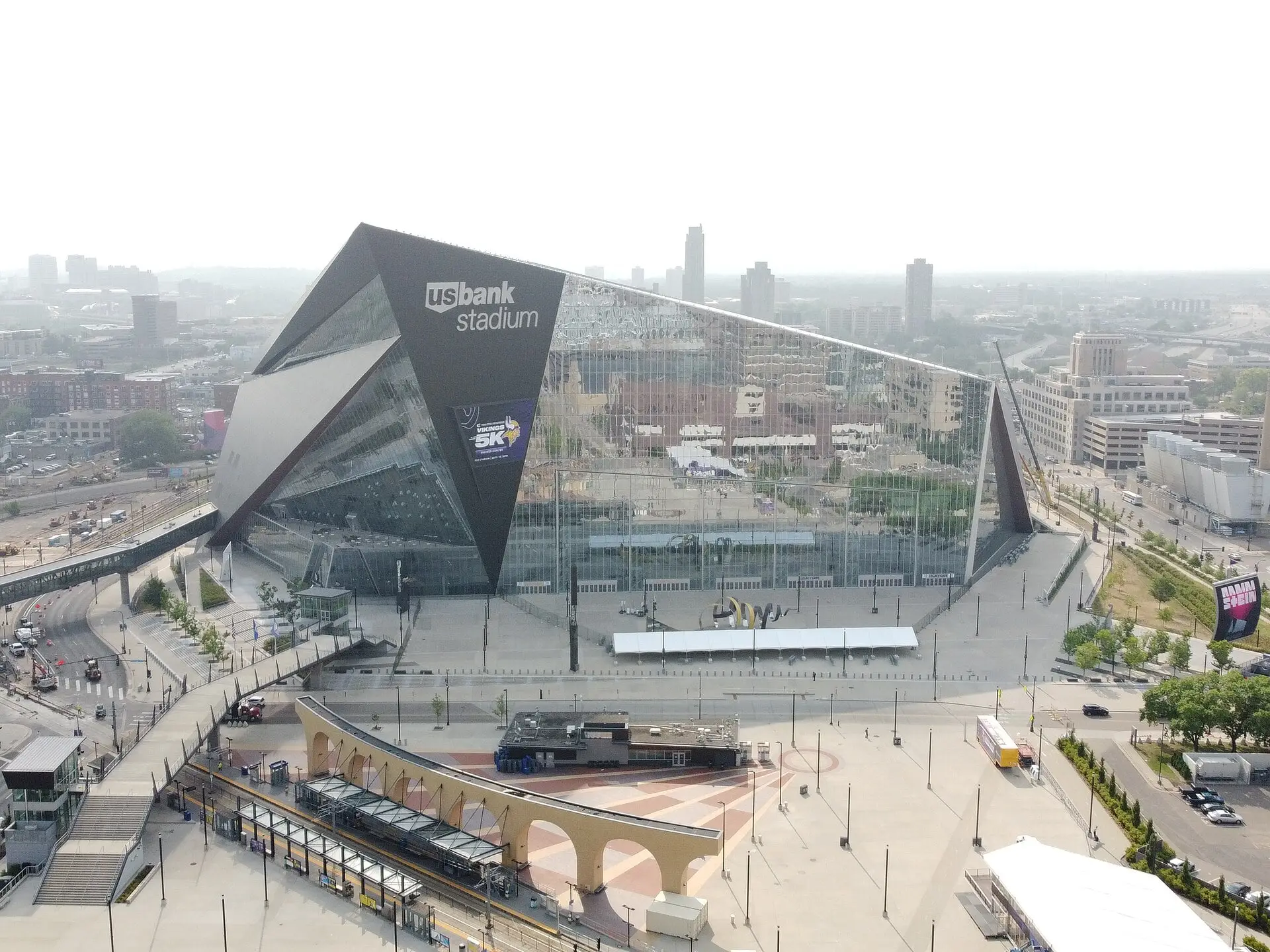 Aerial view of U.S. Bank Stadium and downtown Minneapolis under hazy skies