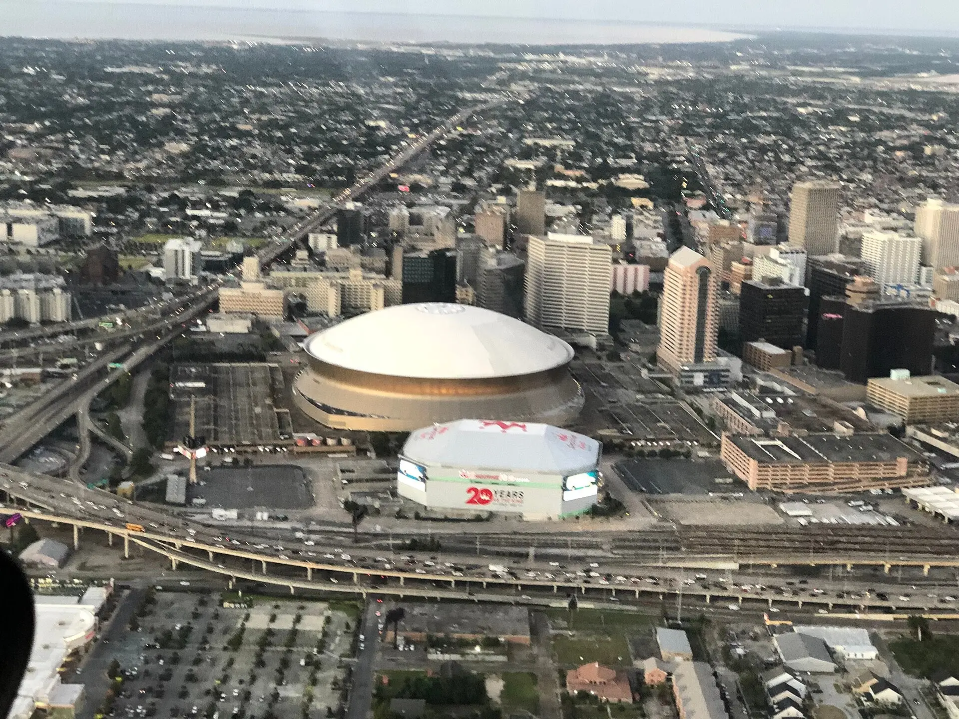 Aerial view of the Superdome and the neighboring arena beside Interstate 10 in New Orleans, September 2019